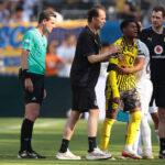 New Jersey, USA, 5th July 2025. Fran Garcia of Real Madrid embraces Julien Duranville of Borussia Dortmund as he leaves the field of play with medical staff after picking up an injury in a clash with the Spanish full back during the Real Madrid vs Borussia Dortmund FIFA Club World Cup match at Metlife Stadium, New Jersey. Picture credit should read: Jonathan Moscrop / Sportimage EDITORIAL USE ONLY. No use with unauthorised audio, video, data, fixture lists, club/league logos or live services. Online in-match use limited to 120 images, no video emulation. No use in betting, games or single club/league/player publications. SPI_101_JM_REALMADRID_BORUSSIA_ SPI-4005-0101